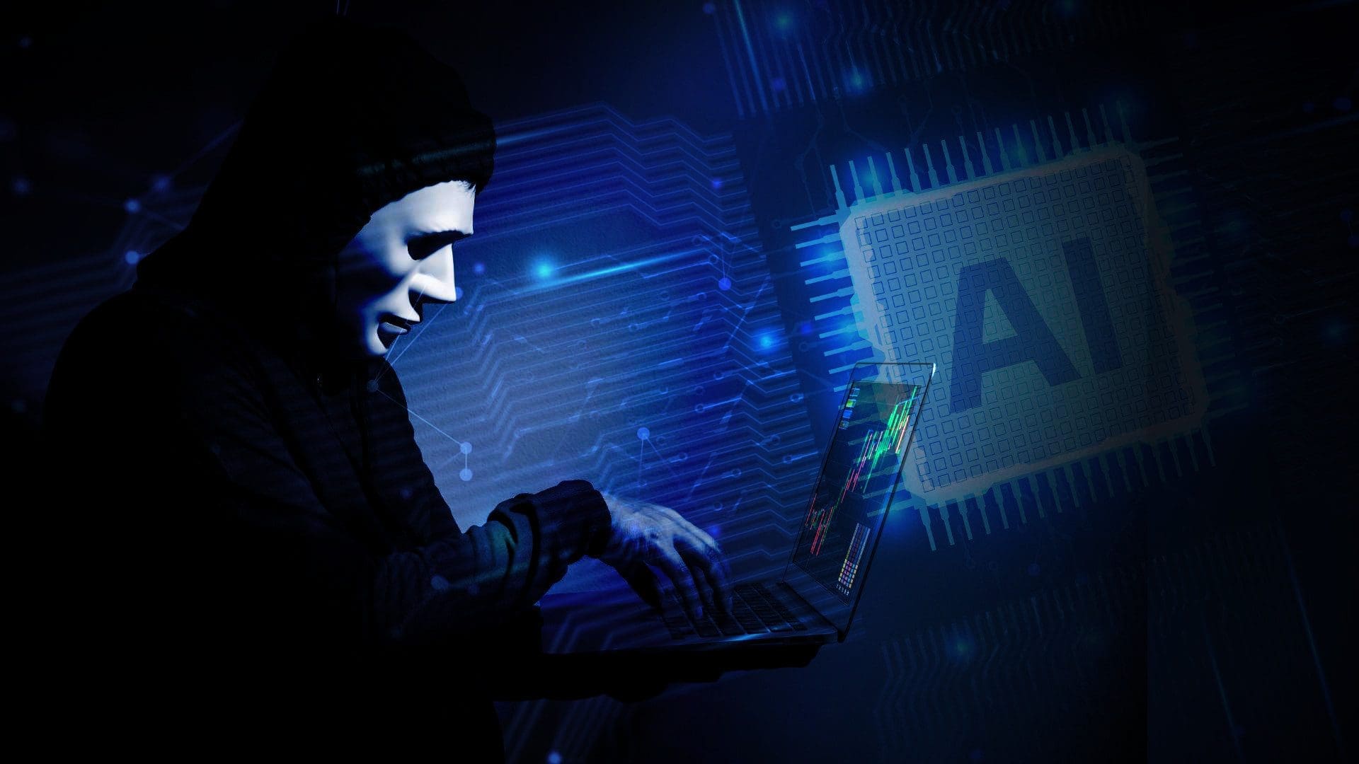 Hacker in a white mask with laptop in front of them